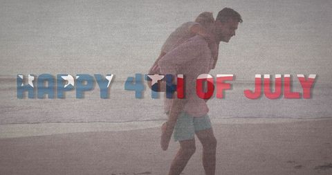 Couple Celebrating Fourth of July on Beach at Sunset