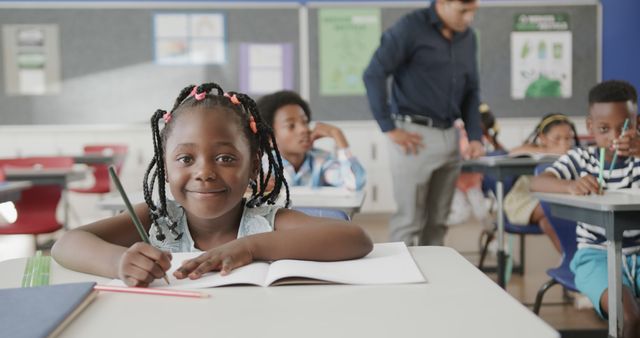 Excited African American Schoolgirl Writing in Classroom - Download Free Stock Images Pikwizard.com