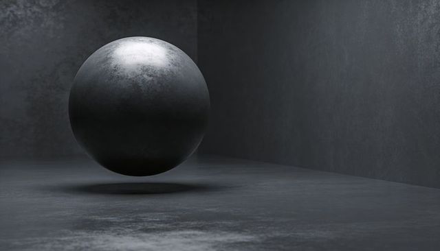 Floating dark metal sphere in minimalist concrete corner with dramatic lighting