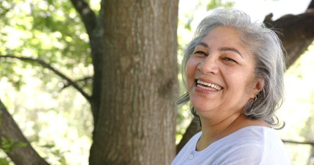 Smiling Senior Woman Enjoying Nature in Sunny Park - Download Free Stock Images Pikwizard.com