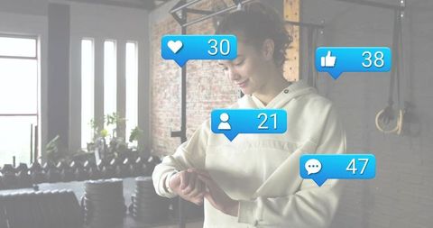 Woman checking smartwatch at gym with social media notification bubbles