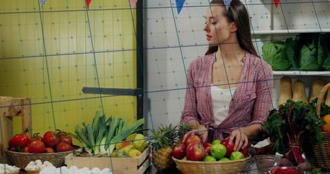 Market Vendor Arranging Fresh Apples in Rustic Setting