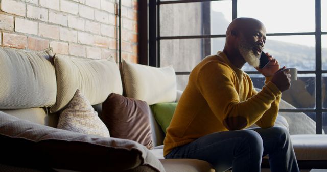 Man Talking on Phone at Home While Drinking Coffee - Download Free Stock Images Pikwizard.com