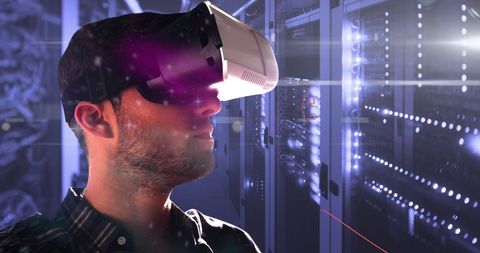 Man Using Virtual Reality in Futuristic Server Room - Download Free Stock Images Pikwizard.com