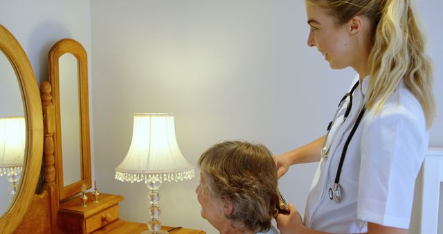 Caregiver Brushing Senior's Hair in Comfortable Home Environment - Download Free Stock Images Pikwizard.com