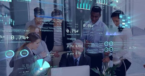Business team collaborating around laptop with holographic data dashboards and analytics