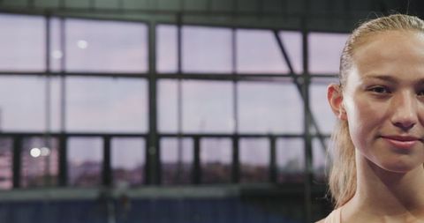 Confident Young Woman in Padel Tennis Court Ready for Action