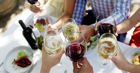Friends Toasting with Wine at Outdoor Dining Table - Download Free Stock Images Pikwizard.com