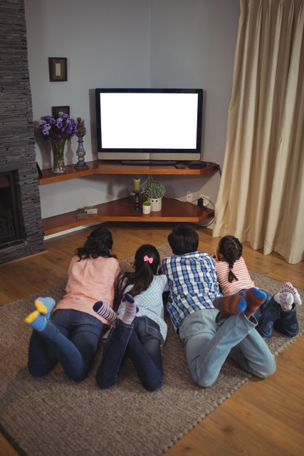 Transparent Family Relaxing Watching Television In Living Room On Rug - Download Free Stock Videos Pikwizard.com