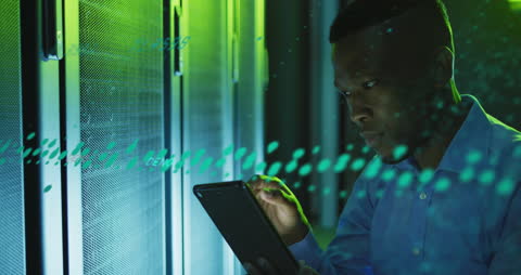 Engineer Using Tablet in Server Room with Digital Overlay