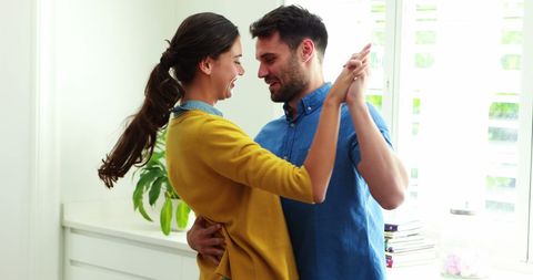 Joyful Couple Dancing Together in Bright Kitchen - Download Free Stock Images Pikwizard.com