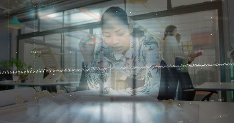 Female Engineer Analyzing Architectural Model in Contemporary Workplace