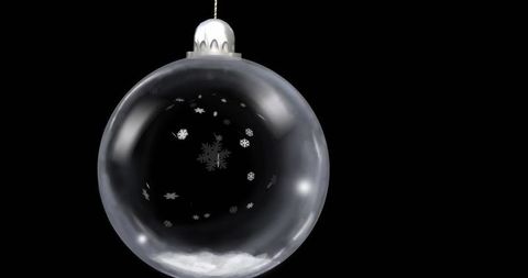 Transparent Glass Bauble with Snowflake Patterns on Black Background