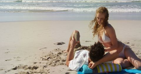 Couple Enjoying Relaxing Day on Sunny Beach - Download Free Stock Images Pikwizard.com
