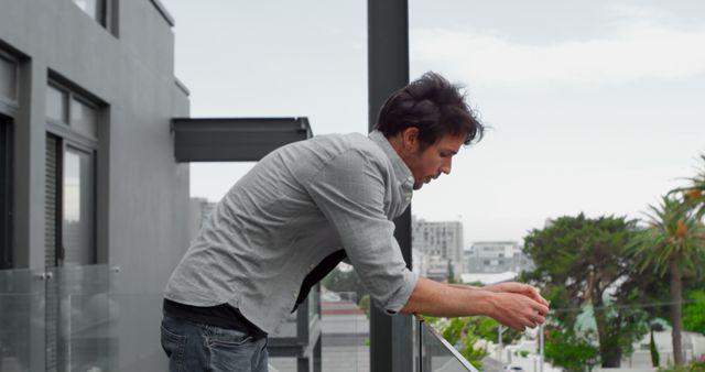 Pensive Man Reflecting on Balcony Perspective - Download Free Stock Images Pikwizard.com