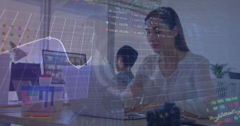 Businesswoman Analyzing Financial Data on Laptop with Stock Market Charts - Download Free Stock Images Pikwizard.com
