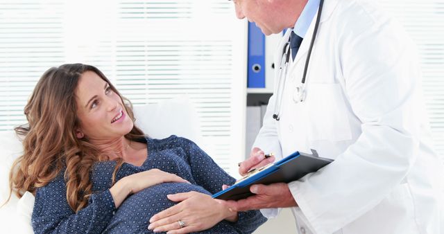 Pregnant Woman Consulting Doctor in Medical Office - Download Free Stock Images Pikwizard.com