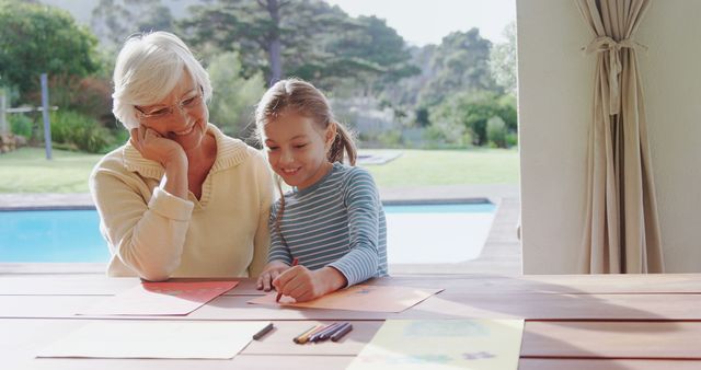 Senior Woman Enjoying Art Activities with Granddaughter by Pool - Download Free Stock Images Pikwizard.com