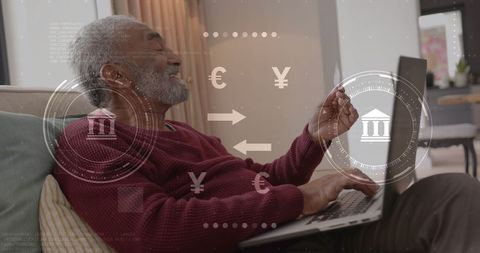 Elderly man engaging in digital banking transaction with laptop