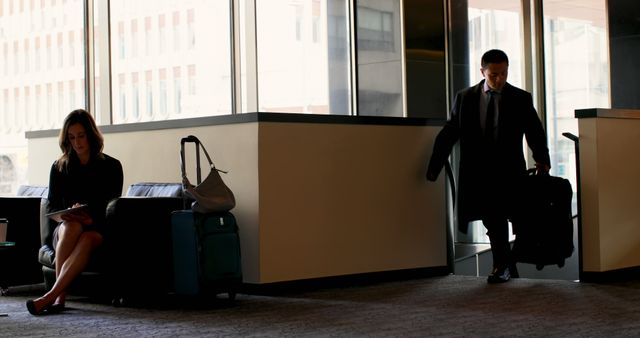 Business Travelers with Luggage in Airport Waiting Area - Download Free Stock Images Pikwizard.com