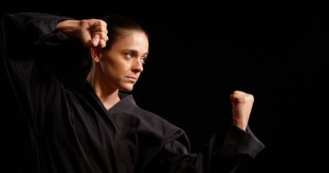 Focused karate practitioner performing powerful stance