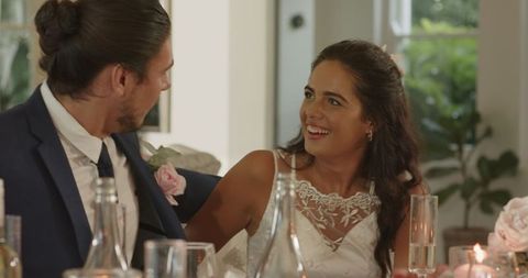 Joyful Bride Engaging with Wedding Guests at Reception