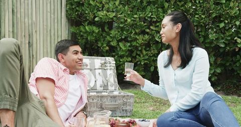 Couple Enjoying Relaxing Picnic in Serene Garden
