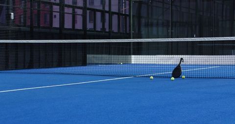 Paddle Tennis Racket on Vibrant Blue Court