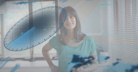 Mature woman interacting with holographic blue data overlay in modern kitchen workspace