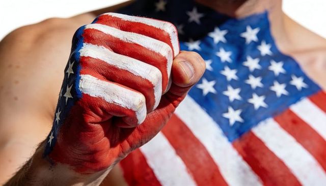 Raising clenched fist painted with american flag, showing patriotic strength and unity