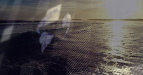 Ethereal sunset seascape with translucent suit and tie overlay and lighthouse horizon