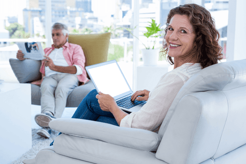 Happy Woman Holding Laptop with Transparent Screen at Home - Download Free Stock Videos Pikwizard.com