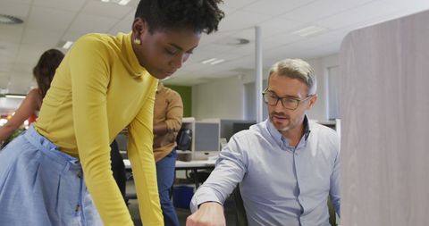 Colleagues Collaborating in Modern Office with Technology