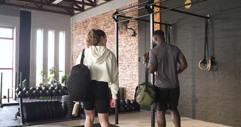 Diverse friends at gym preparing for a workout session
