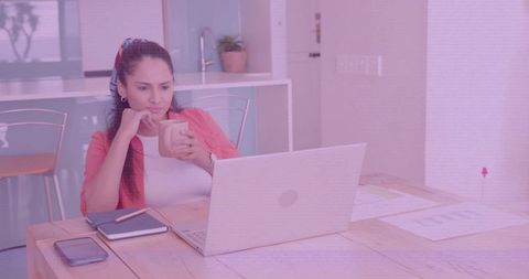 Woman Working from Home with Coffee on Work Desk