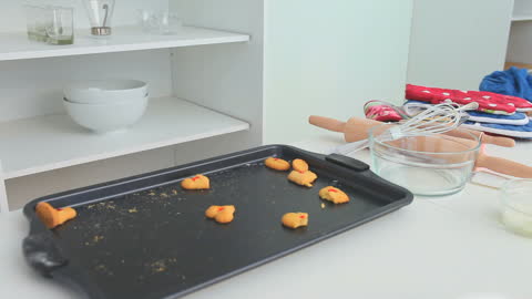 Baking Cookies with Occasional Taste Testing in Kitchen