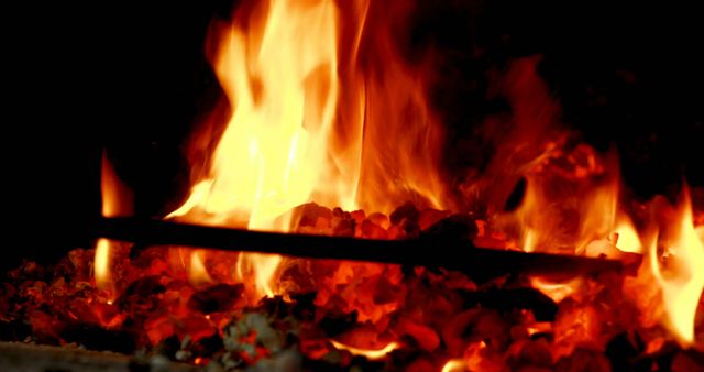 Blacksmith heating metal rod in fire at workshop 4k