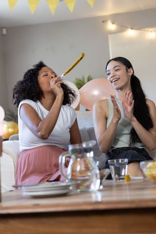 Diverse girls celebrating with decorations and joyful chats