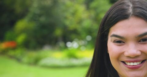 Smiling woman enjoying outdoor garden