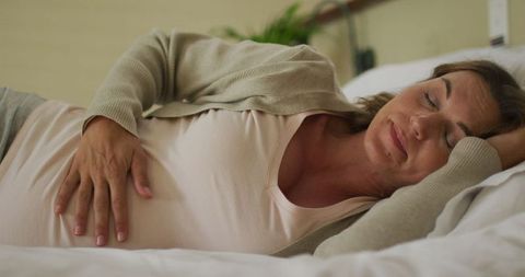 Pregnant Woman Taking Rest on Bed at Home - Download Free Stock Images Pikwizard.com