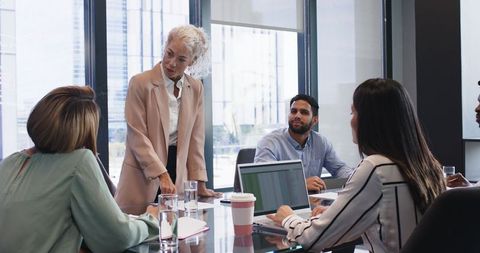 Team Discussing Project Concept in Office Boardroom