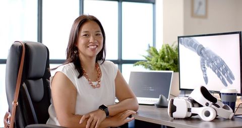 Confident woman engineer working on robotics and vr programming