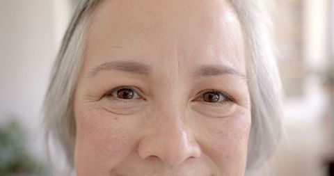 Smiling Elderly Woman Close-Up Highlighting Joyful Expression