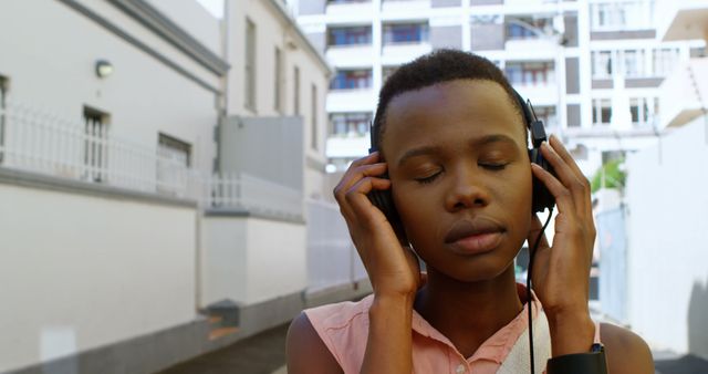 Peaceful Woman Listening to Music with Headphones Outdoors - Download Free Stock Images Pikwizard.com