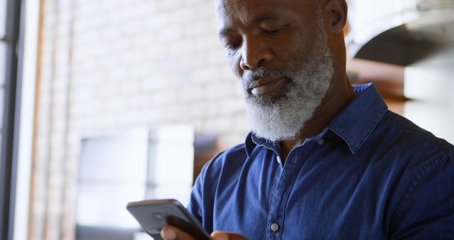 Senior Man Using Smartphone at Home - Download Free Stock Images Pikwizard.com