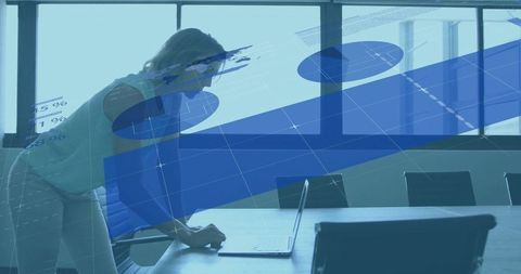 Businesswoman Analyzing Data with Laptop and Chart Overlays