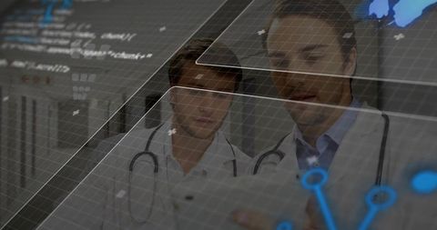 Doctors Examining Digital Data on Tablet in Modern Healthcare Setting