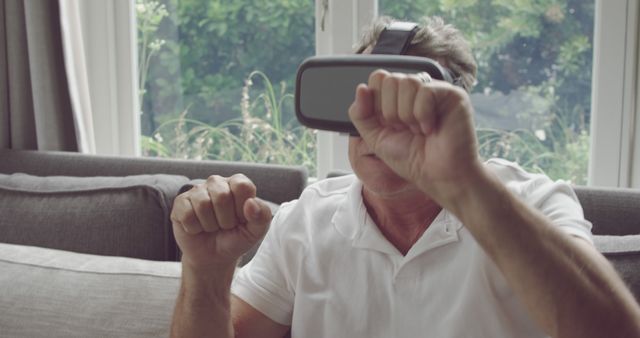 Senior Man Wearing VR Headset Experiencing Virtual Reality at Home - Download Free Stock Images Pikwizard.com