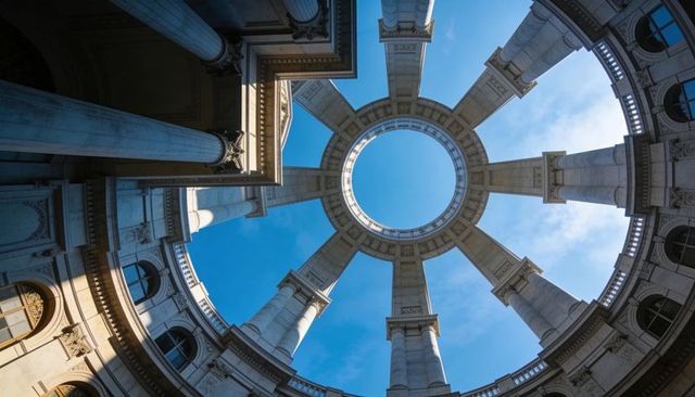 Neoclassical rotunda with circular oculus and fluted columns, skyward architectural detail
