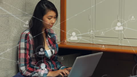 Student Engaging in Online Networking with Laptop